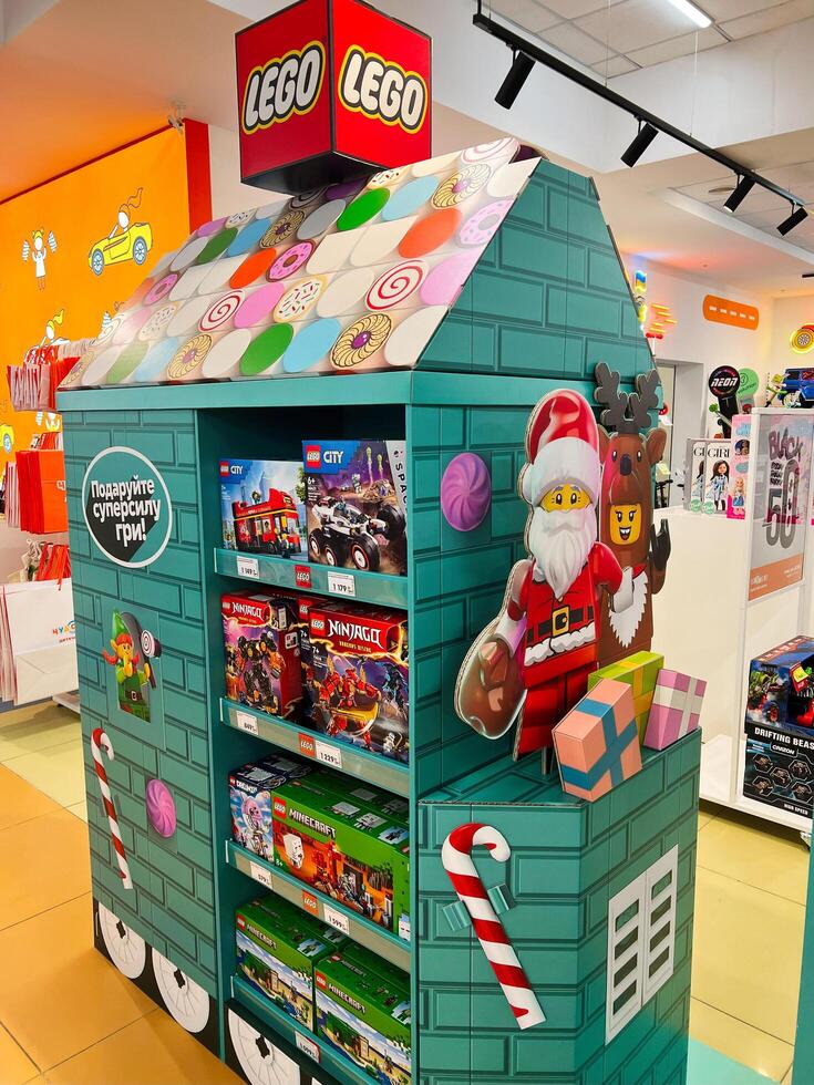 Kyiv, Ukraine - November 20, 2024 Festive LEGO display with Santa and reindeer in toy store photo