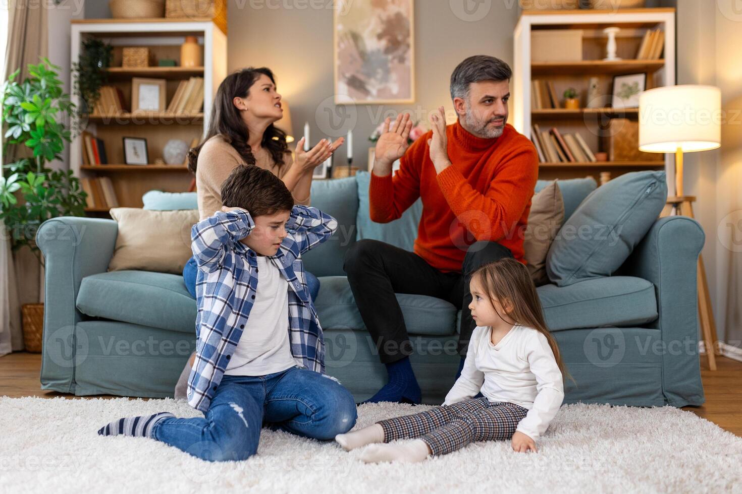 Divorce And Domestic Violence. Portrait of upset son and daughter while their angry parents fighting in the background, depressed children feeling lonely photo