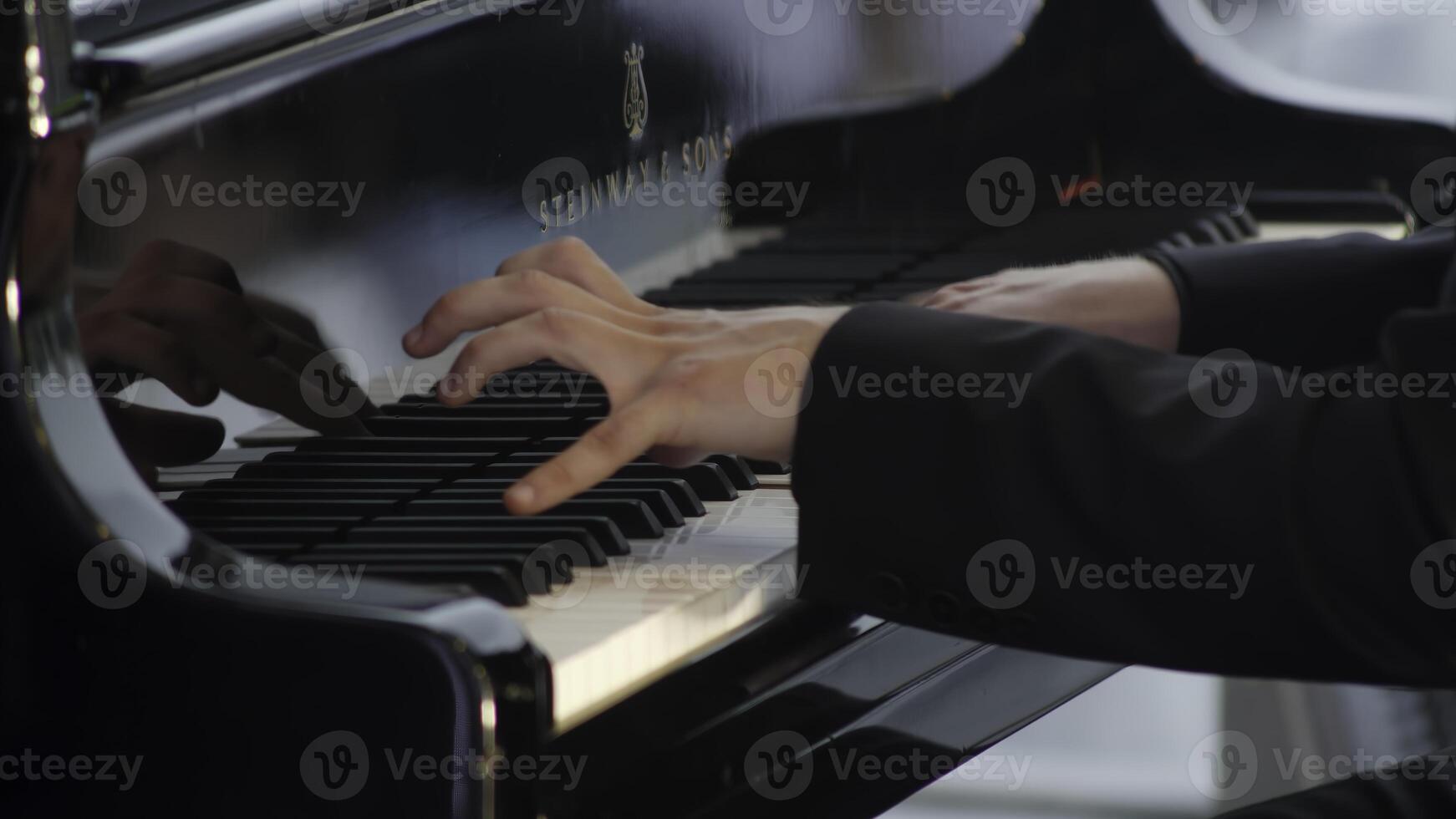 An Enchanting Pianist Showcasing Talent While Performing Beautifully on Grand Piano. Clip photo
