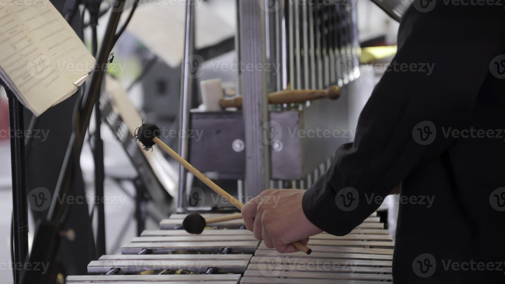 A talented musician passionately playing the vibraphone during an outdoor music performance event. Clip photo