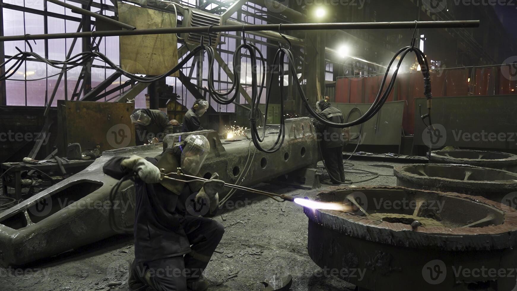 An Industrial Workshop Featuring Workers Operating in a Heavy Machinery Environment. Stock Clip photo