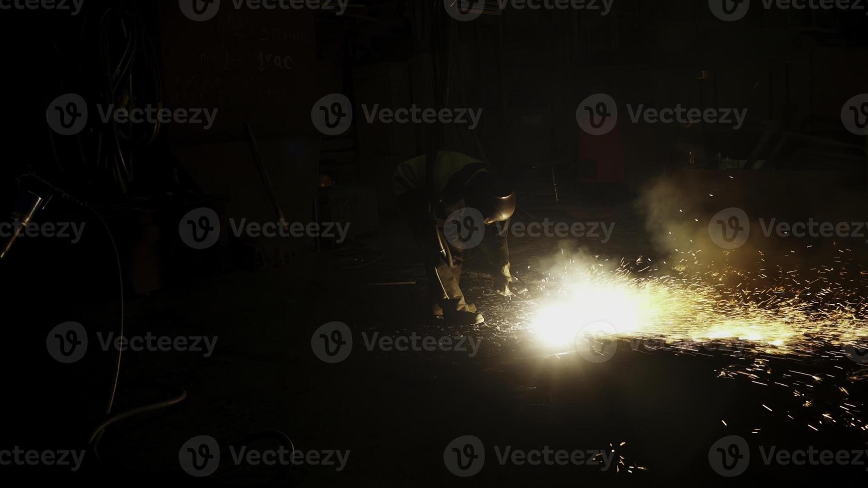 Experience the stunning nighttime sparks from a welding operation in an industrial site. Stock Clip photo