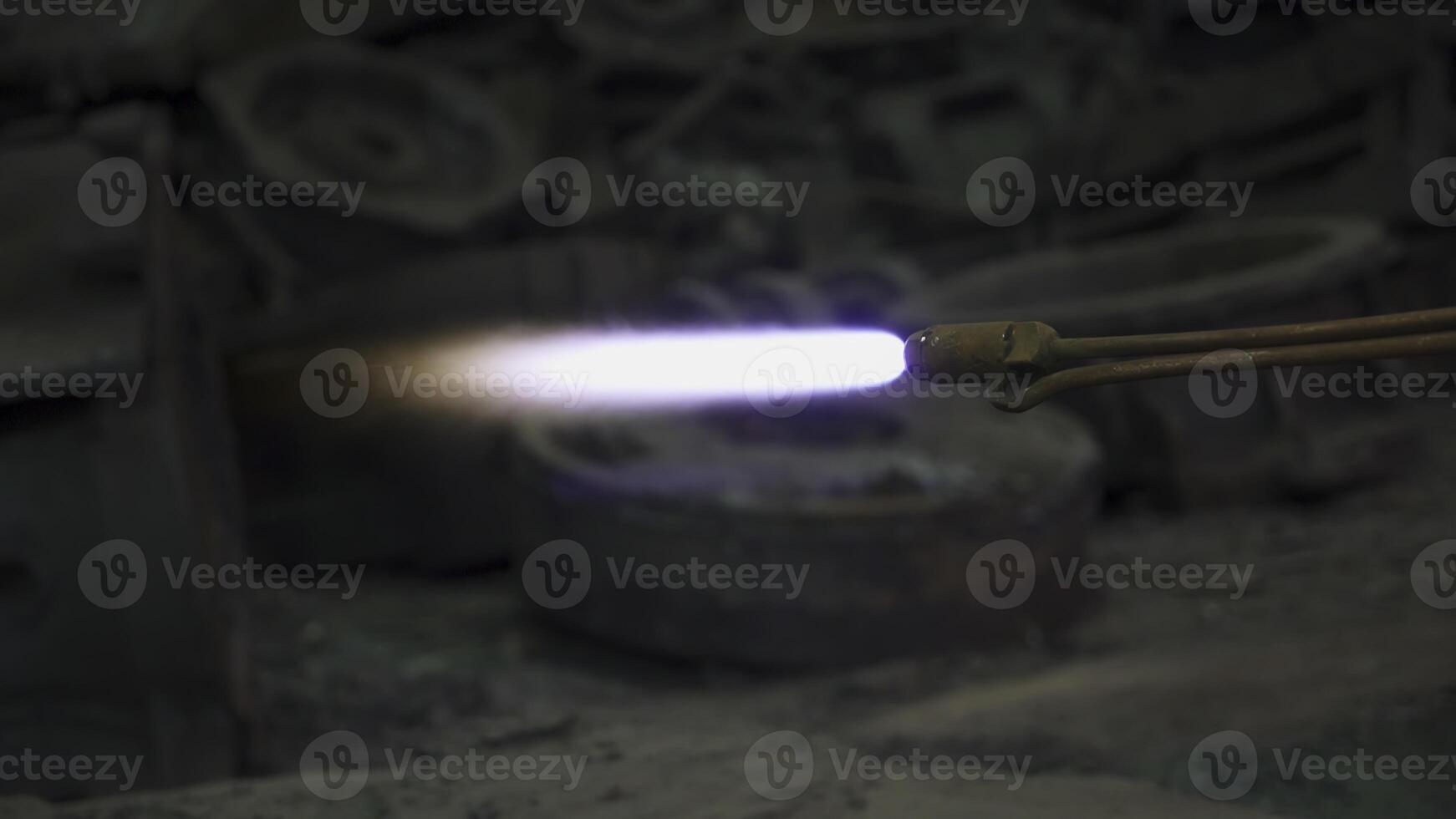 A Flame Torch used in an Industrial Setting specifically for intricate Metalworking tasks. Stock Clip photo