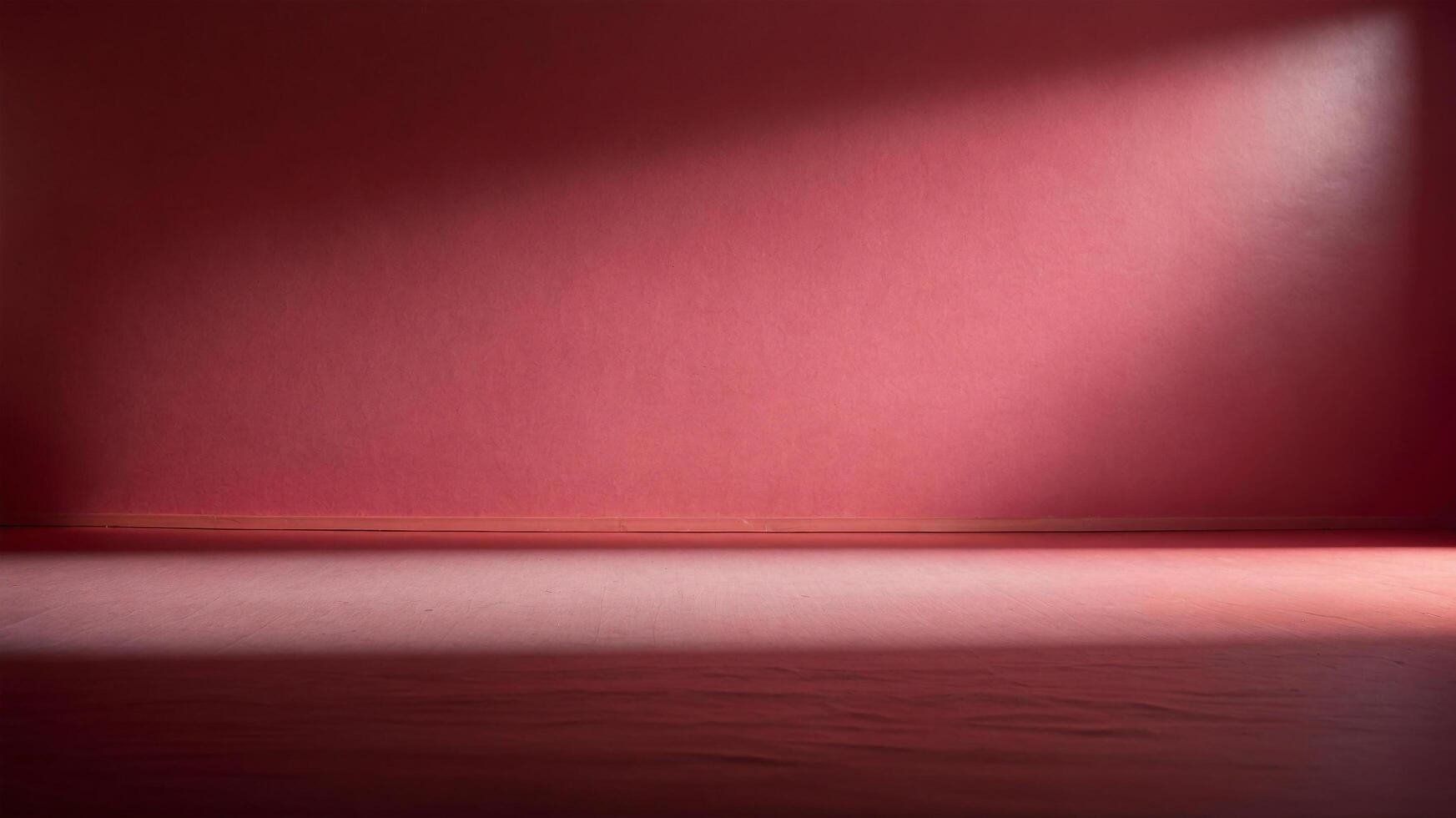 An empty room with a red wall and a light photo