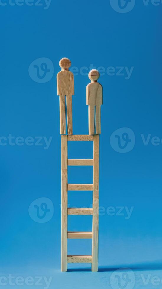 Businessman standing on ladder on blue background. Concept of career growth photo
