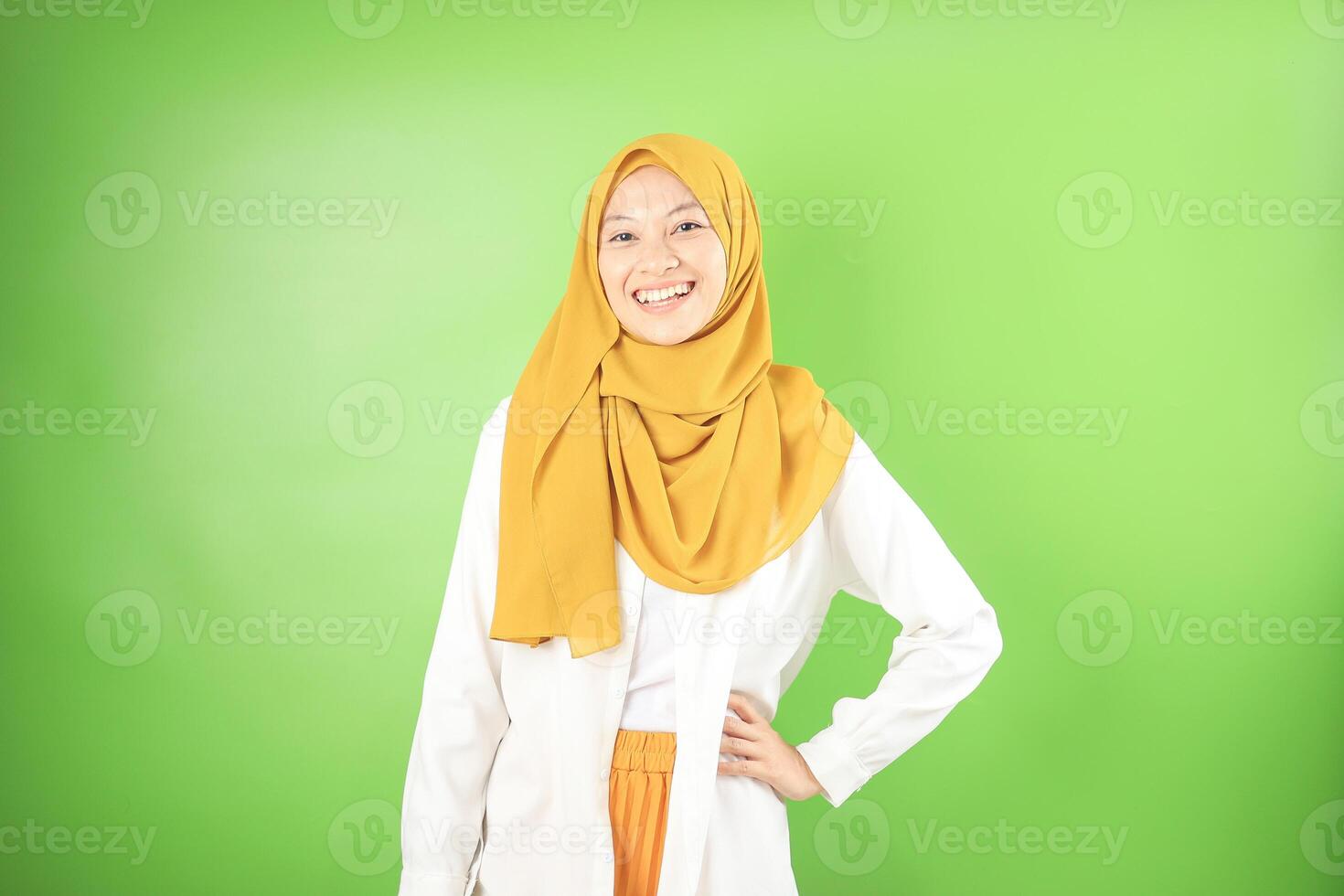 Smiling Female Standing with Veil While Her Hand on Hips photo