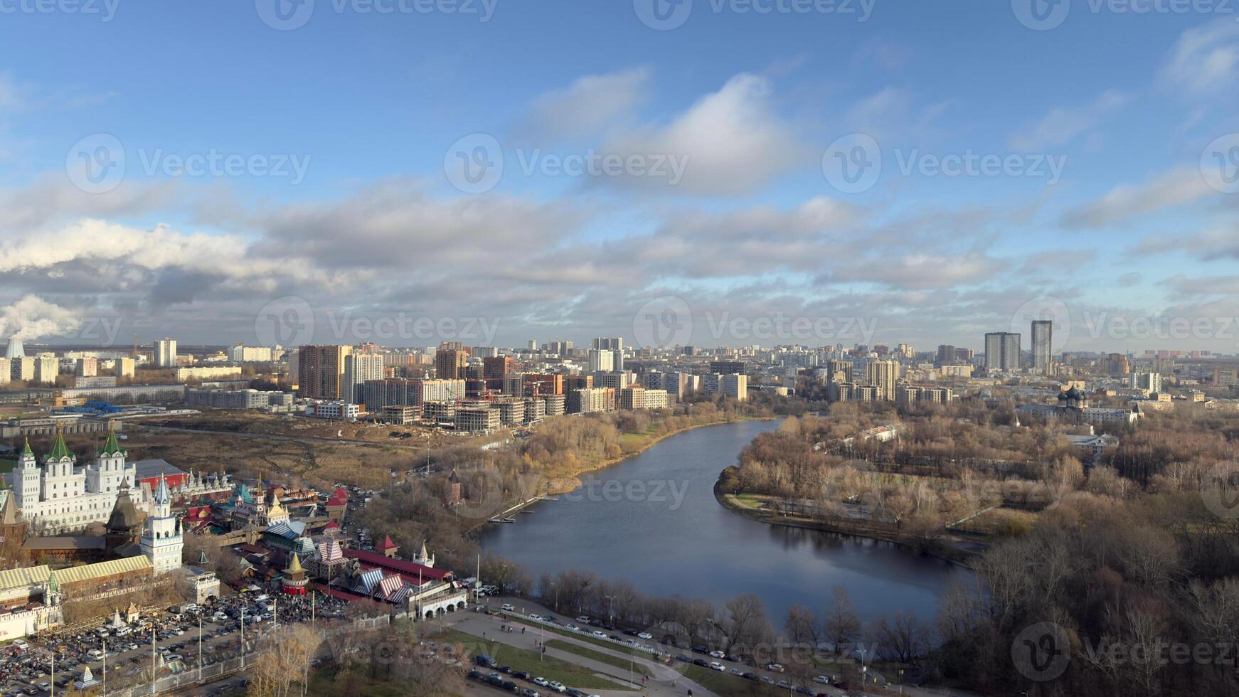 Panorama of Moscow from above overlooking buildings and pond on cold winter day, beautiful view of the capital of Russia in cold season with trees without foliage photo