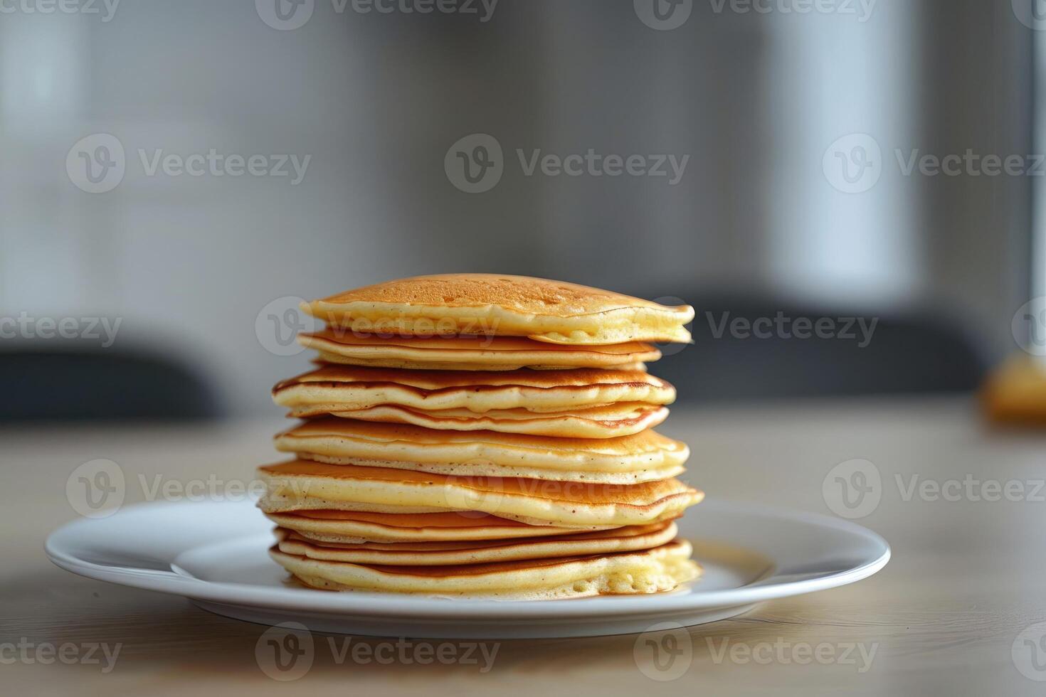 A tall stack of pancakes perfect for a family breakfast with a shallow depth of field and an empty area for additional content photo