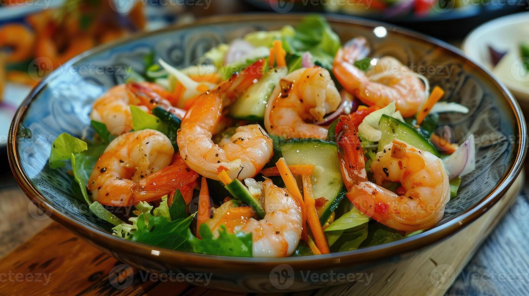 Shrimp salad on wooden table photo