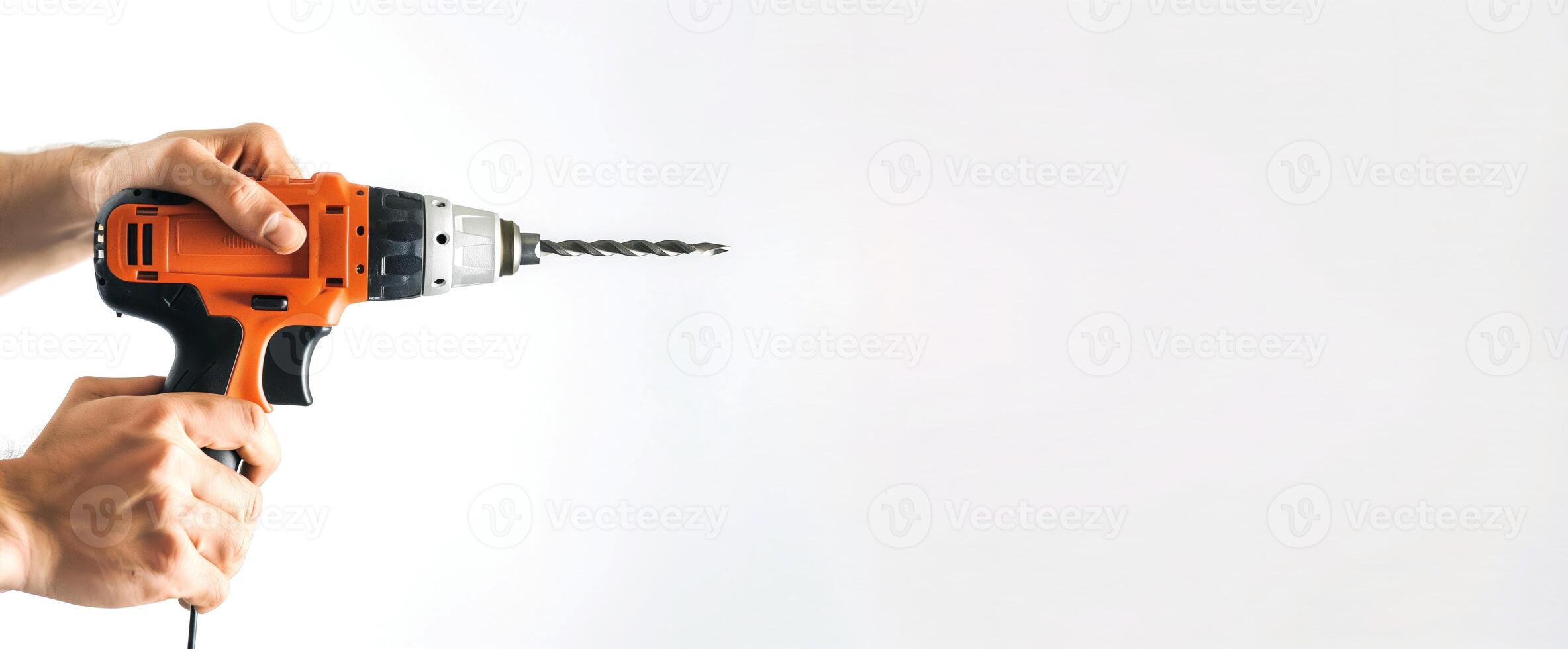Close-up of a man's hand holding a drill on a white background, banner with copy space photo