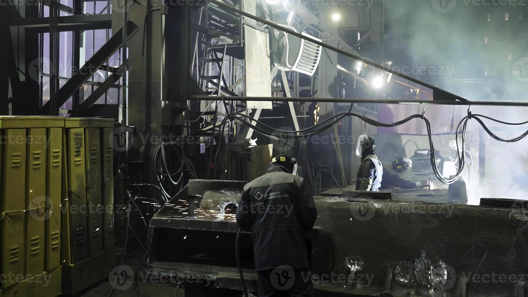 An Industrial Scene Featuring Workers Engaged in Machinery Operations and Activities in Action. Stock Clip photo