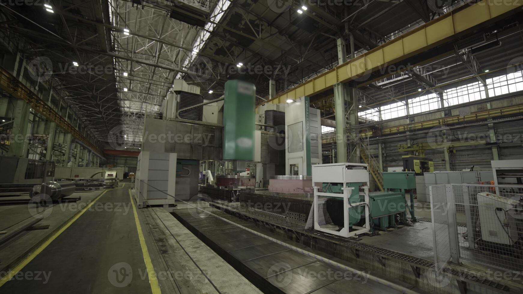 A modern manufacturing facility designed for efficiency with heavy machinery and advanced tech. Stock Clip photo