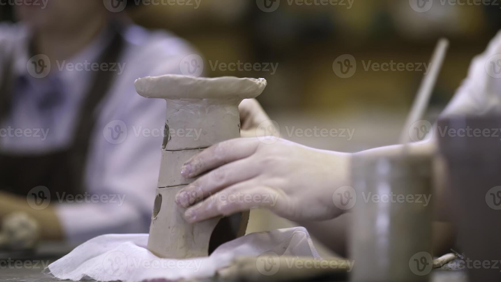 Join our Creative Pottery Workshop to craft unique clay creations with various techniques. Stock Clip photo
