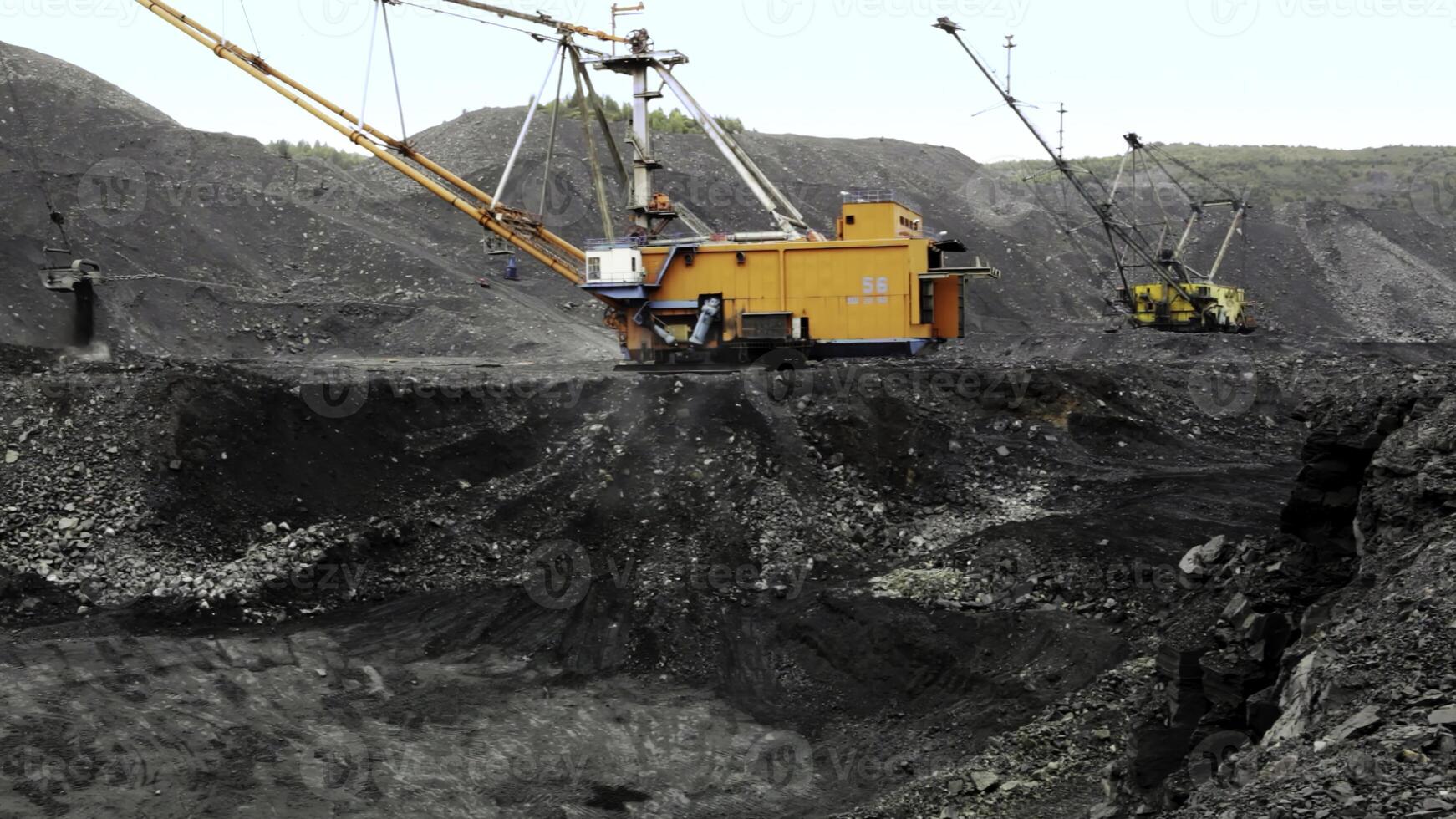 Heavy Machinery Utilized in a Coal Mining Operation for Resource Extraction Efficiency. Stock Clip photo