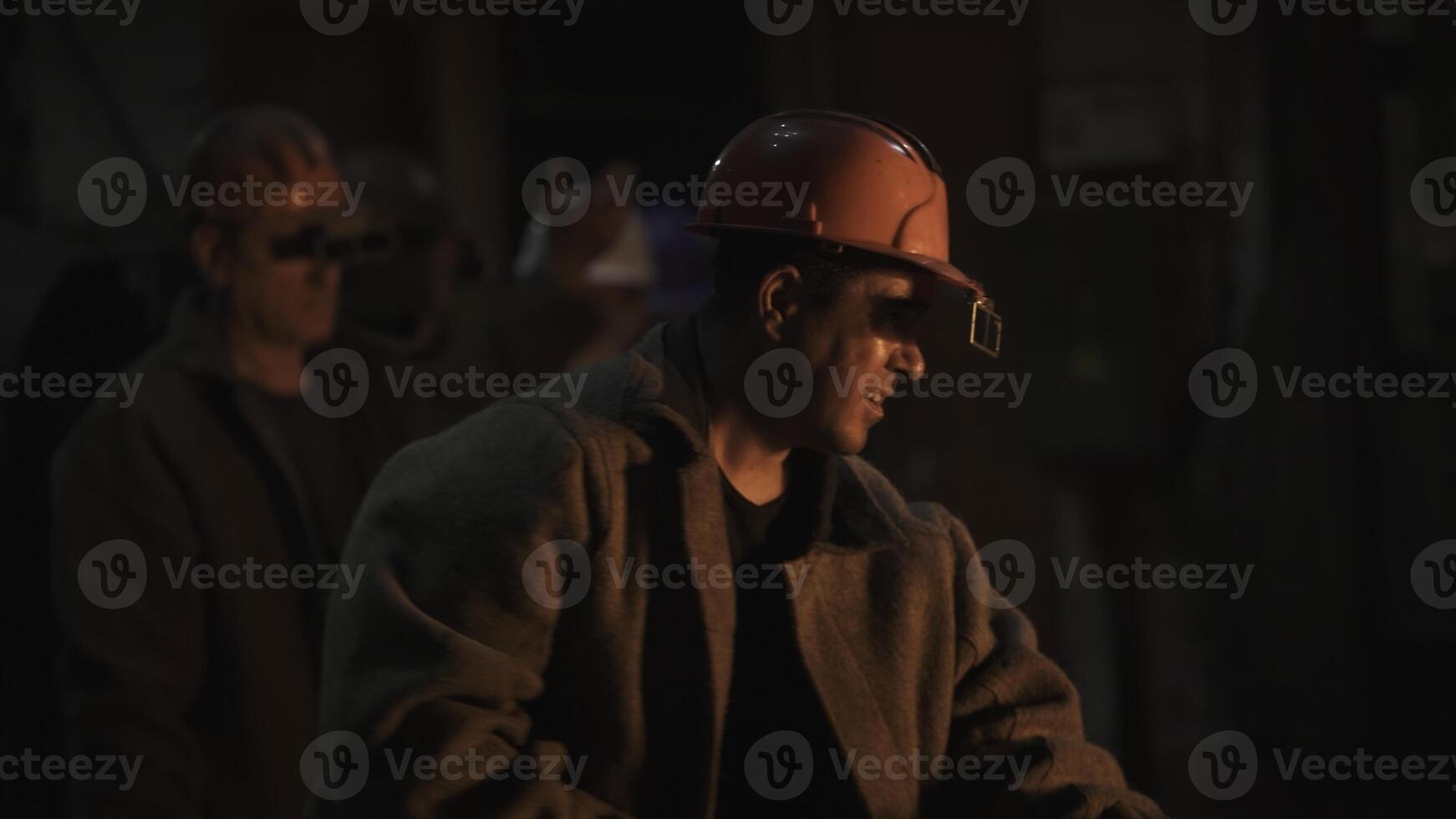 Workers in an Industrial Setting Skillfully Handling Heavy Equipment with Focus and Safety. Stock Clip photo