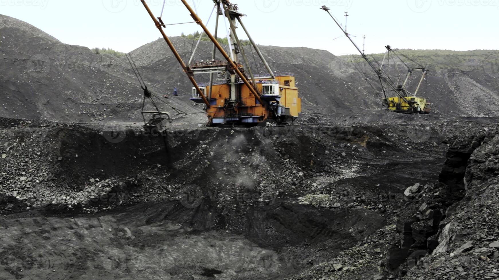 Heavy Machinery Utilized in a Coal Mining Operation for Resource Extraction Efficiency. Stock Clip photo