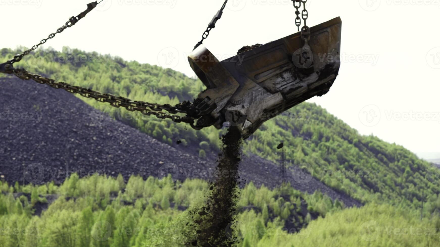 Heavy Machinery Efficiently Operating in a Lush, Green Mining Landscape Encompassing Natures Beauty. Stock Clip photo