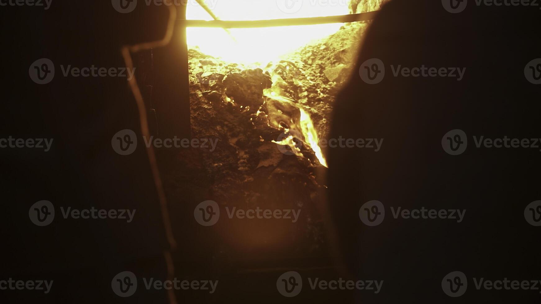 Engaging in Crafting Activities Within the Blazing Heat of the Furnace Environment. Stock Clip photo