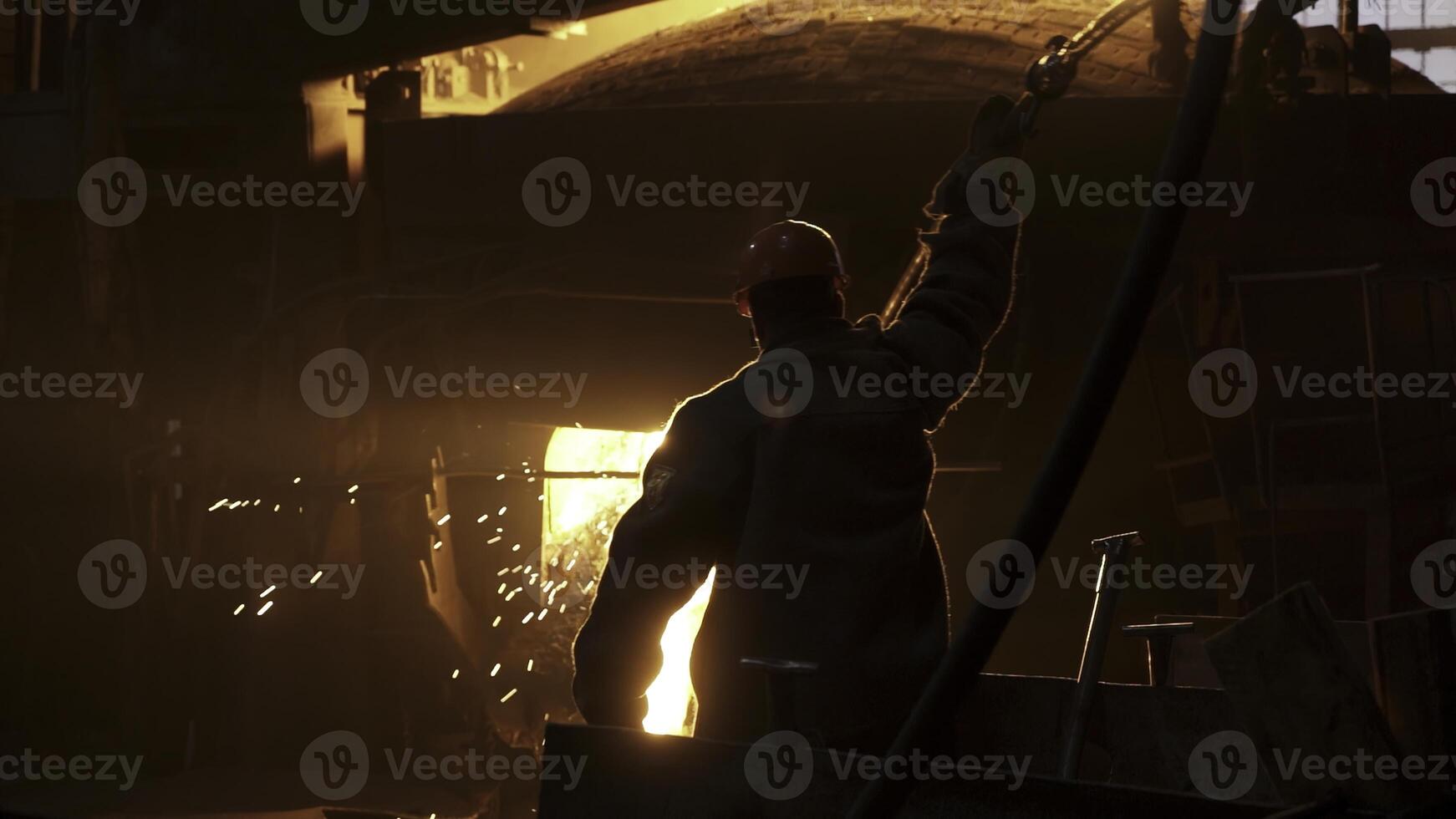 A dedicated workers silhouette shines in an industrial setting, highlighting their key role. Stock Clip photo