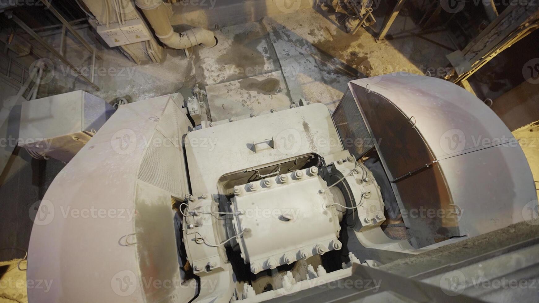 Industrial Machinery in Operation with Dust Presence and Material Flow Dynamics Observed. Stock Clip photo