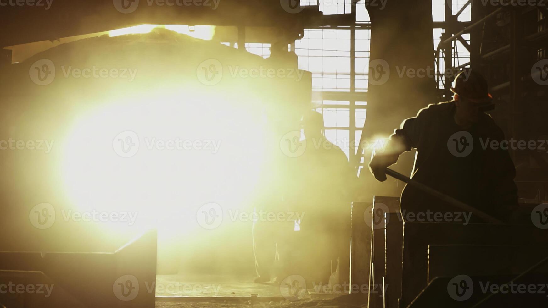 An Industrial Worker within a Heavy Machinery Environment with various dynamics and actions. Stock Clip photo