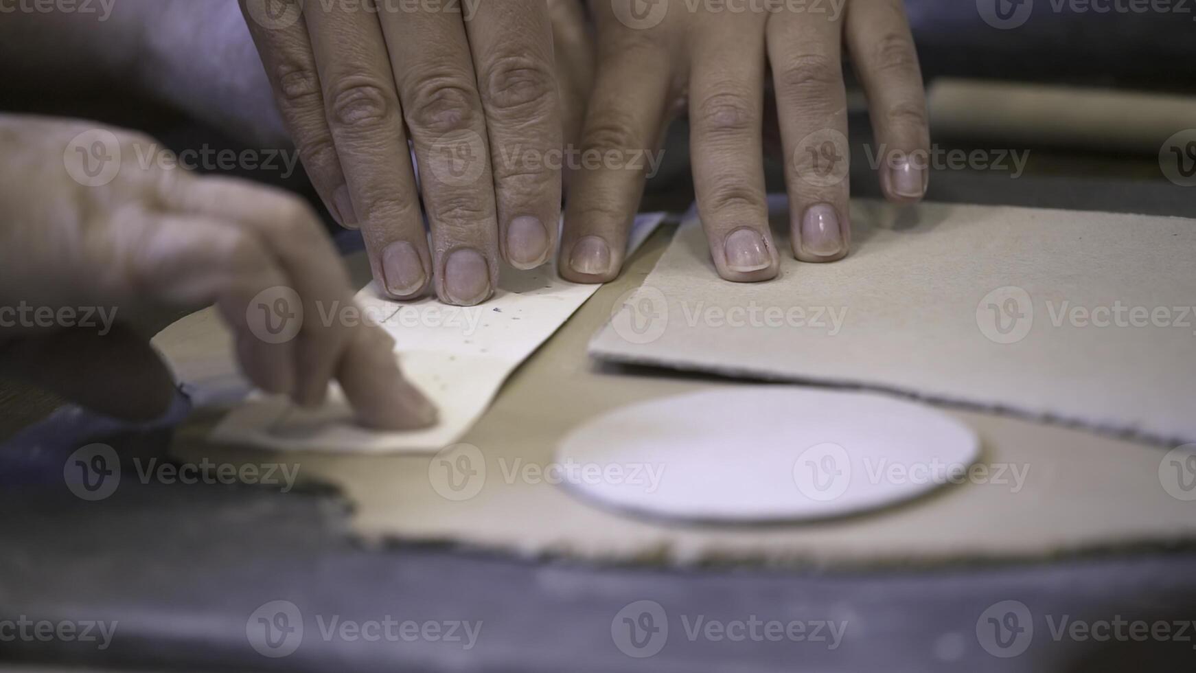 Hands Engaged in the Art of Working on Pottery Crafting and Exploring Techniques. Stock Clip photo