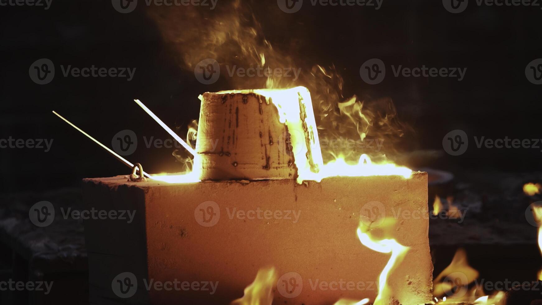 Metal Casting Process Involves the Pouring of Molten Steel into Molds for Shaping Objects. Stock Clip photo