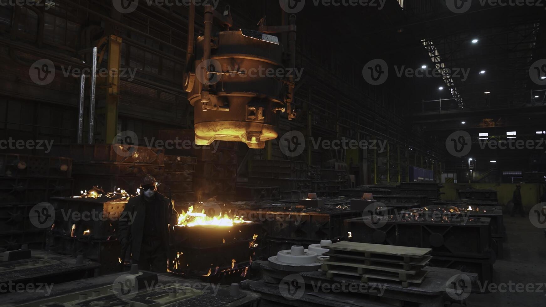 Metal casting in an industrial foundry involves various techniques and operations. Stock Clip photo