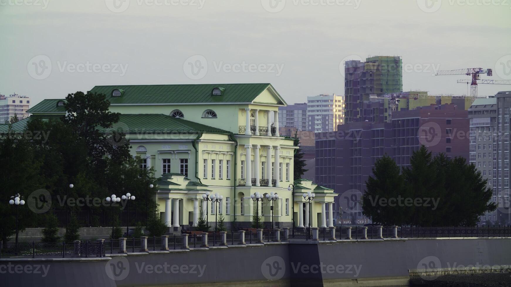 A Historic Building with a Modern Skyline in the Background, Creating a Unique Visual Contrast. Stock Clip photo