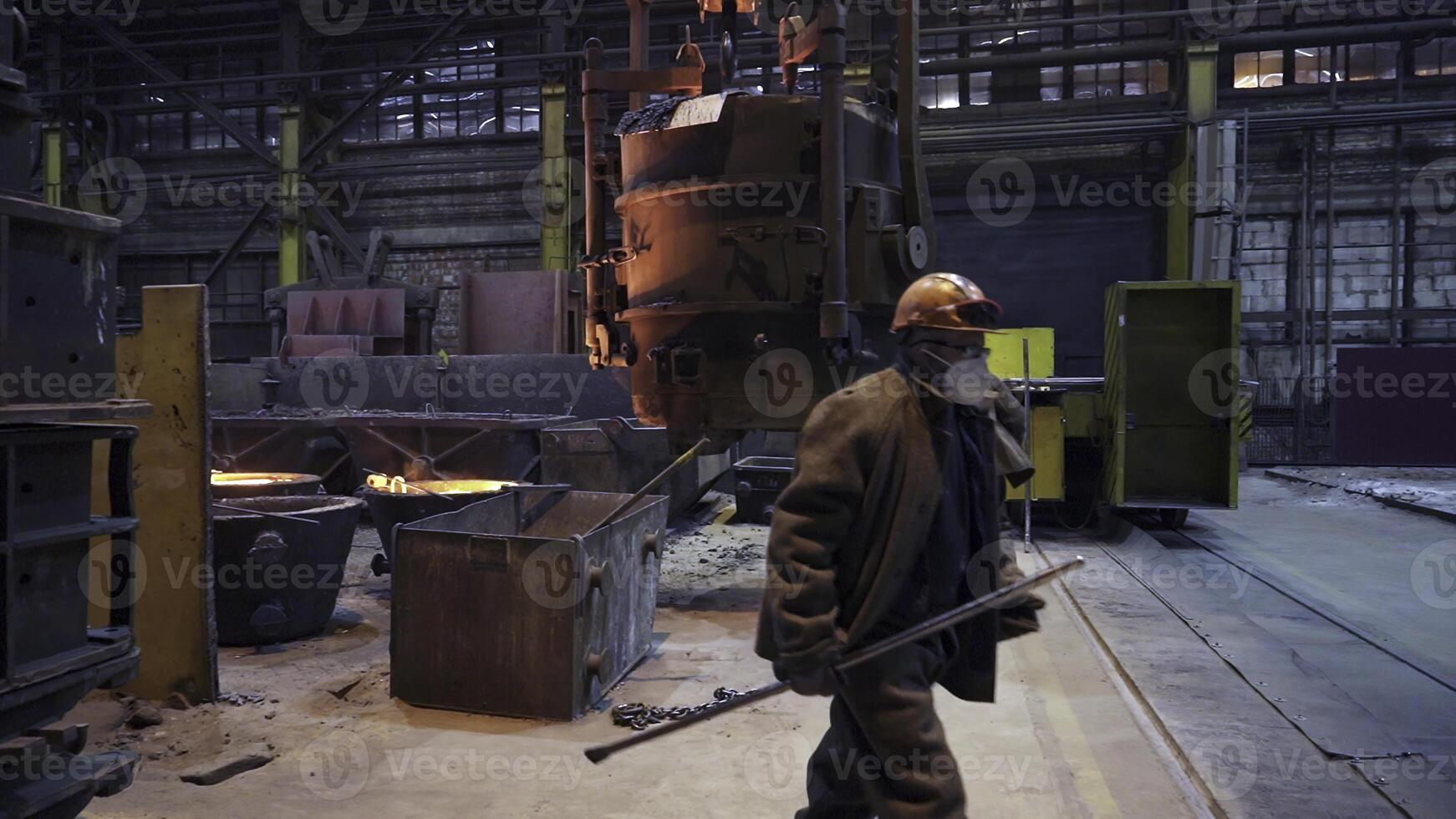 Workers in an Industrial Factory Making Use of Heavy and Advanced Machinery on Site. Stock Clip photo