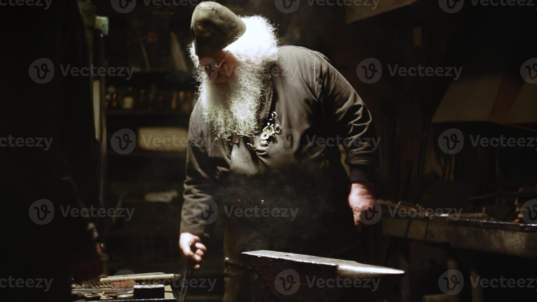 The Art and Craftsmanship Displayed in the Forge A Blacksmith Diligently at Work on His Craft. Stock Clip photo
