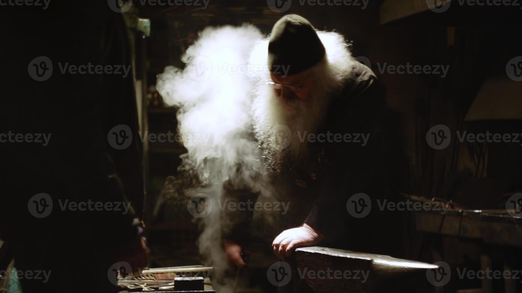 The Art and Craftsmanship Displayed in the Forge A Blacksmith Diligently at Work on His Craft. Stock Clip photo
