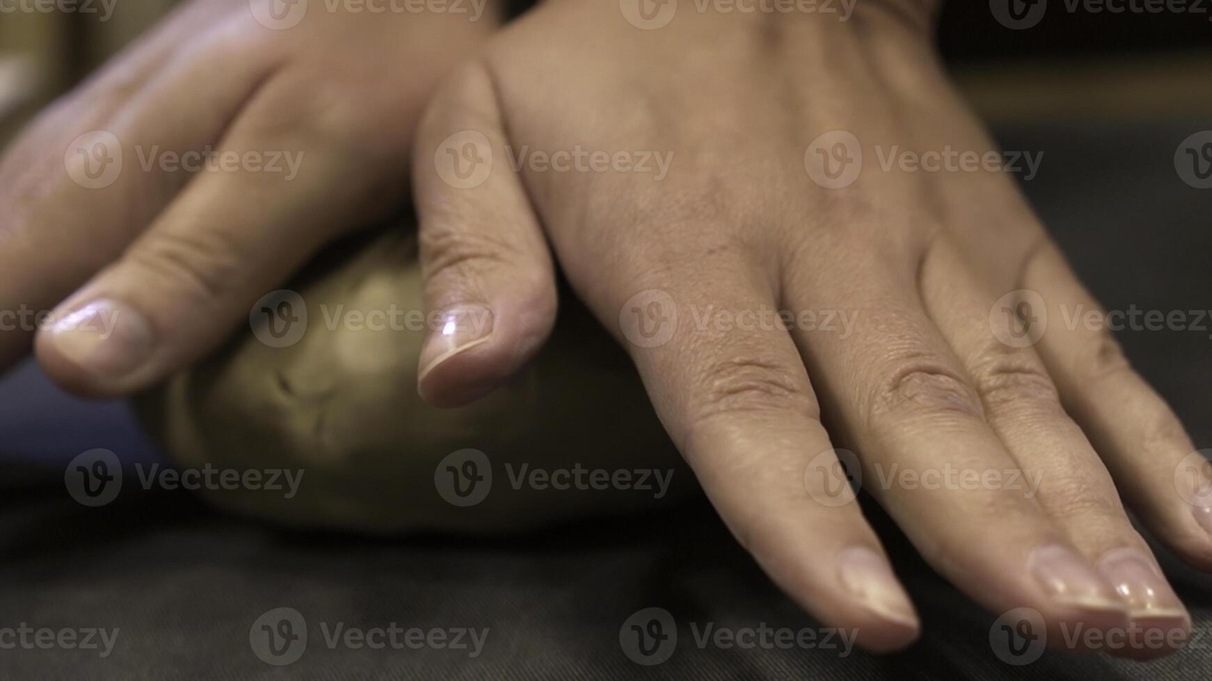 Hands are skillfully shaping clay in a pottery workshop where creativity blends with craft. Stock Clip photo