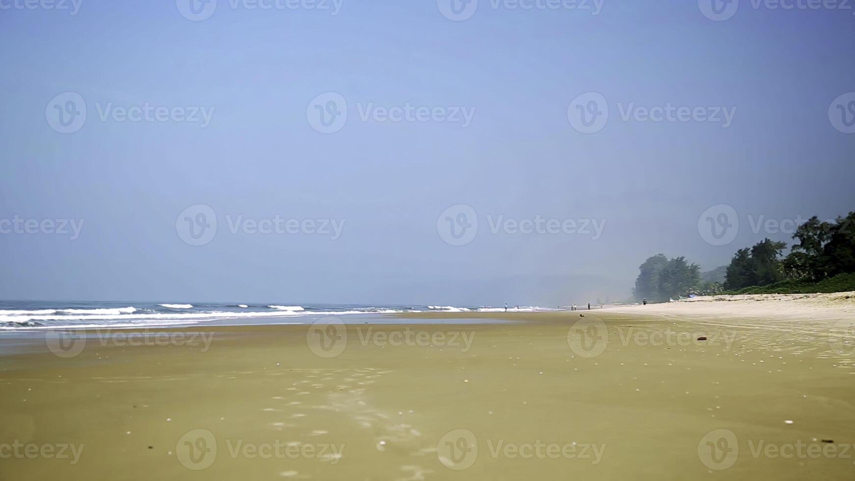 A Serene Beach Landscape Featuring Gentle Waves, Clear Skies, and a Peaceful Atmosphere. Stock Clip photo