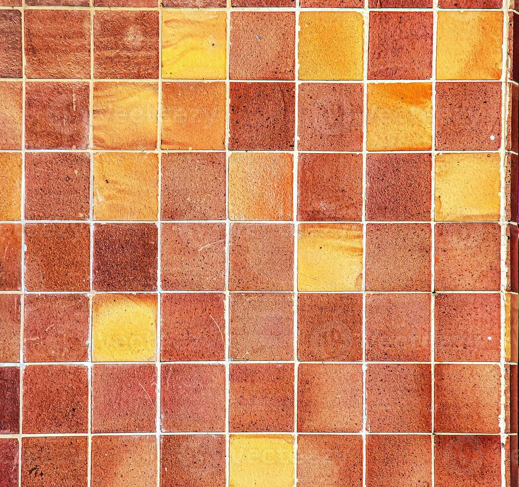 Ceramic tiles in orange tones. Background or texture photo