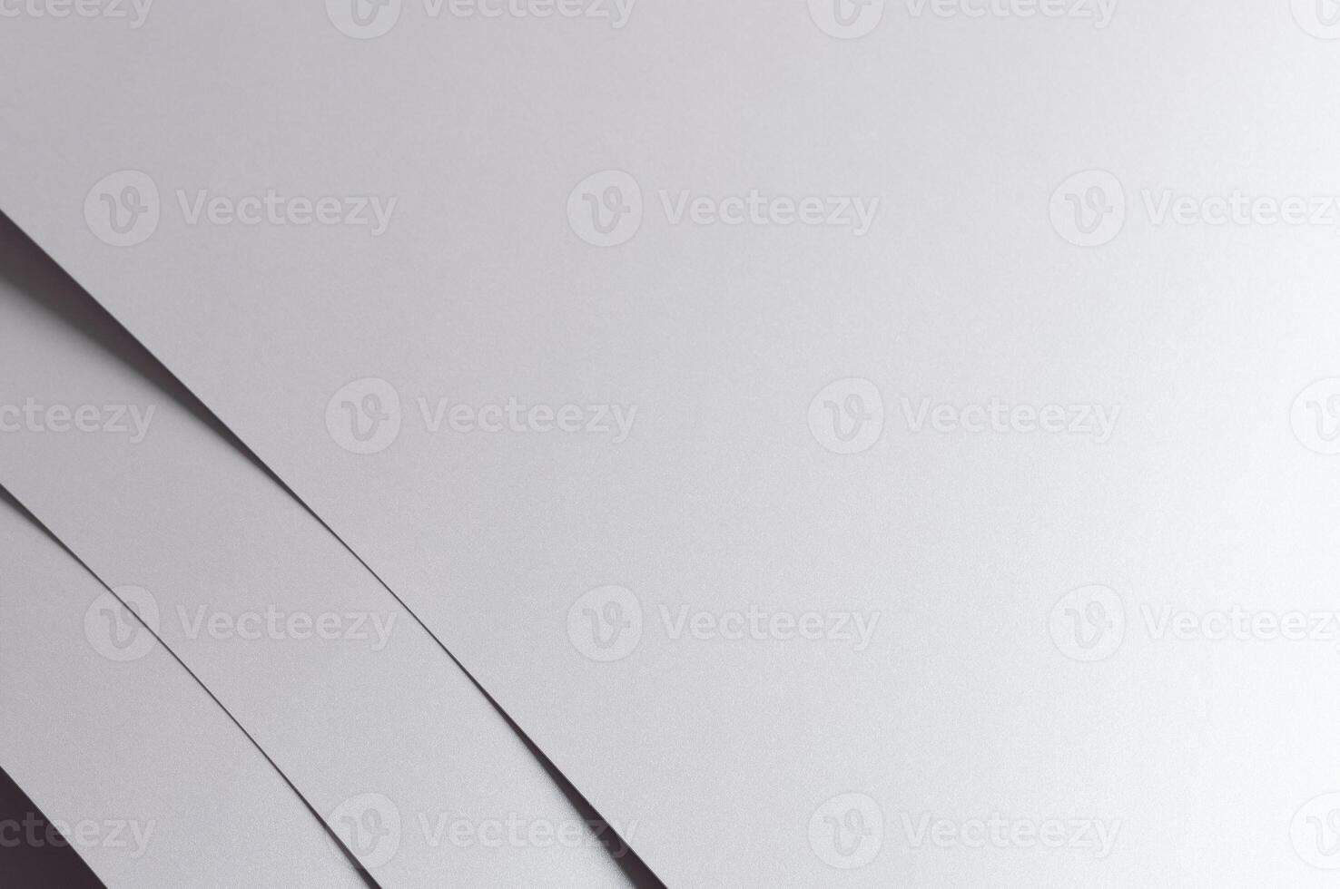 Gray paper background with a sleek monochrome texture and subtle geometric lines. Featuring soft photo