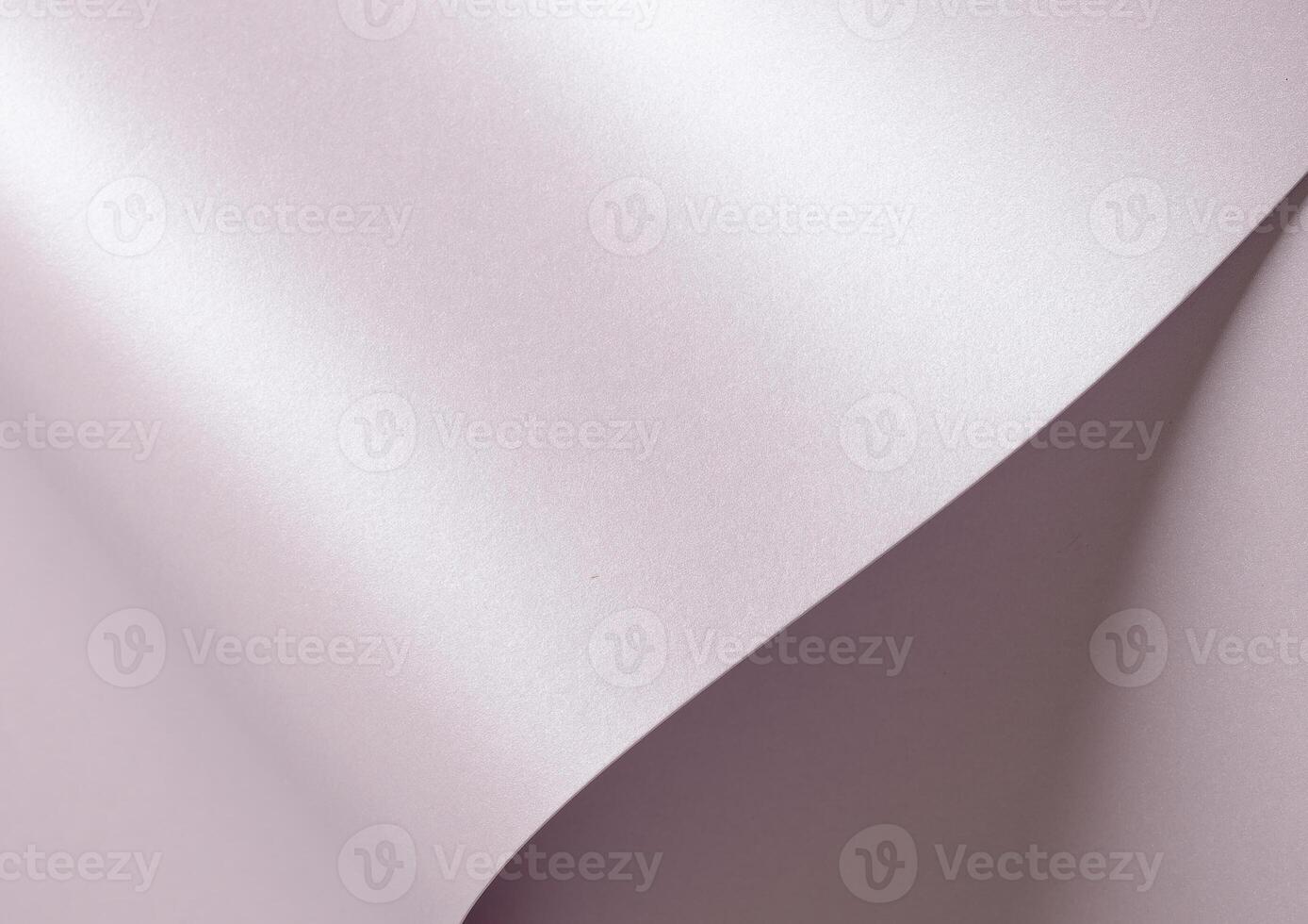 Light pastel lavender paper background with a smooth satin texture and subtle glossy sheen. photo