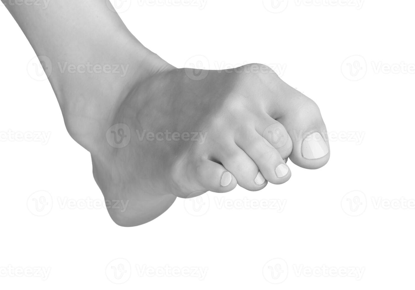 Gray foot with tense toes and ankle. Barefoot model showing inward posture, stress, and cramp. photo