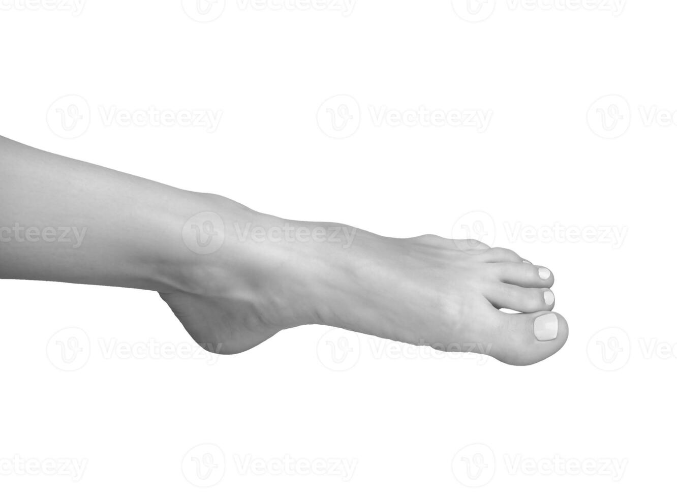 Gray scale foot, barefoot leg in soft, healthy pose. Stepping with big toe in neat stance, photo