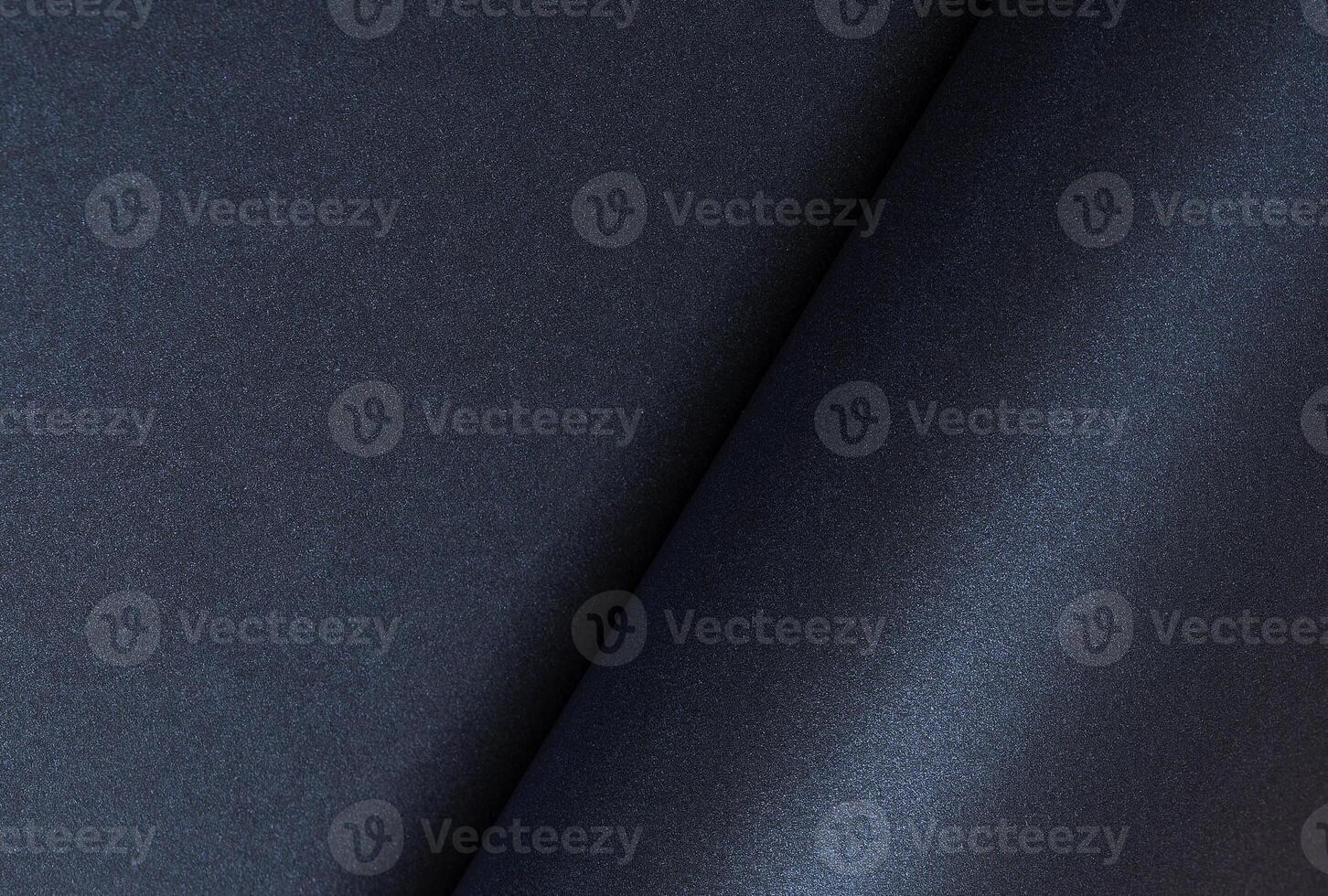 Dark blue rolled paper background with a smooth, shiny surface. Elegant and minimalist design with photo