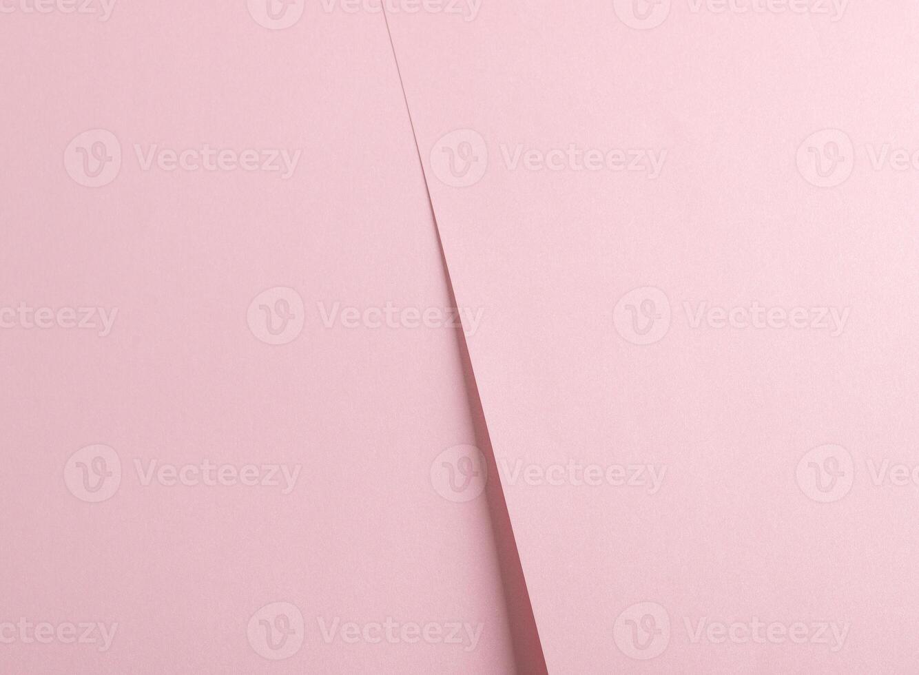 Pink split paper background with a soft matte texture and subtle gradient. Minimalist and elegant photo
