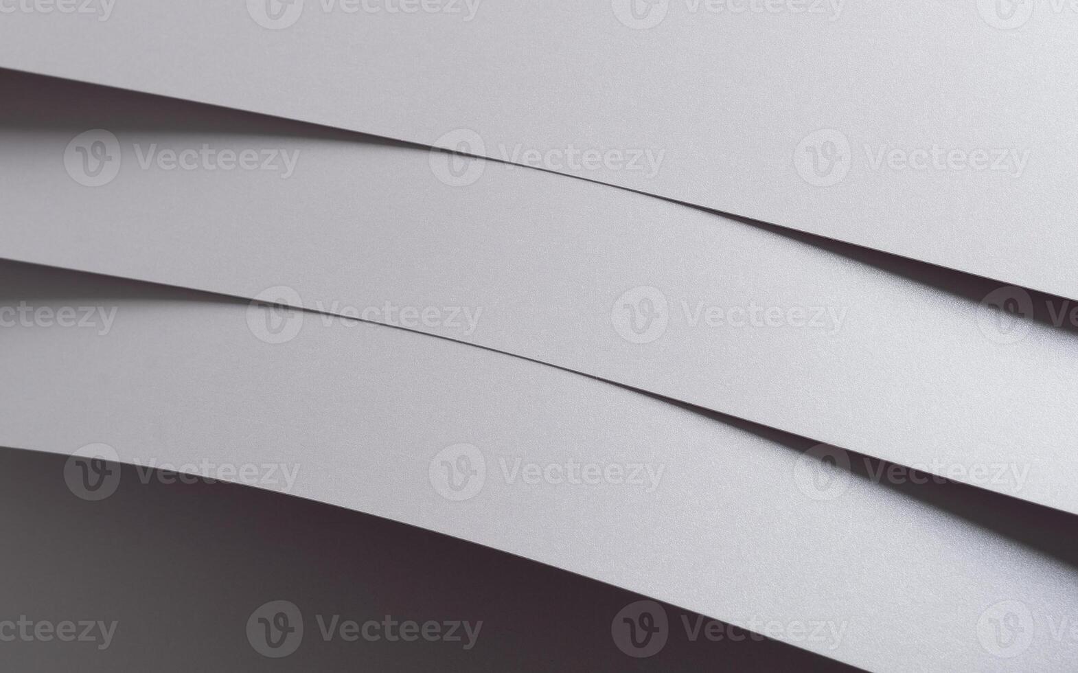Gray paper background with a subtle grayscale pattern and clean geometric lines. Featuring soft photo
