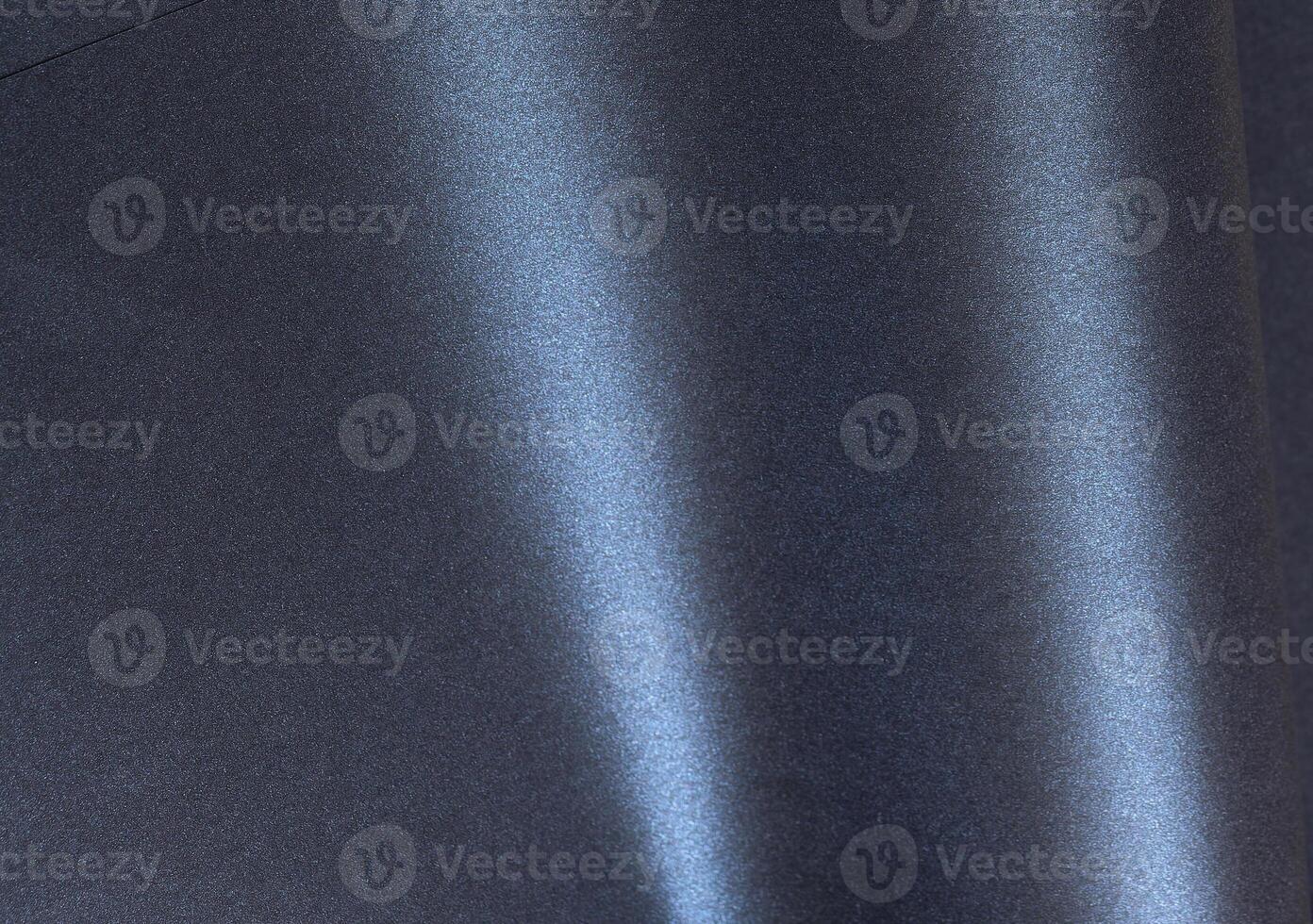 Dark metallic paper background with a glossy, smooth texture and gradient tones. Elegant and photo