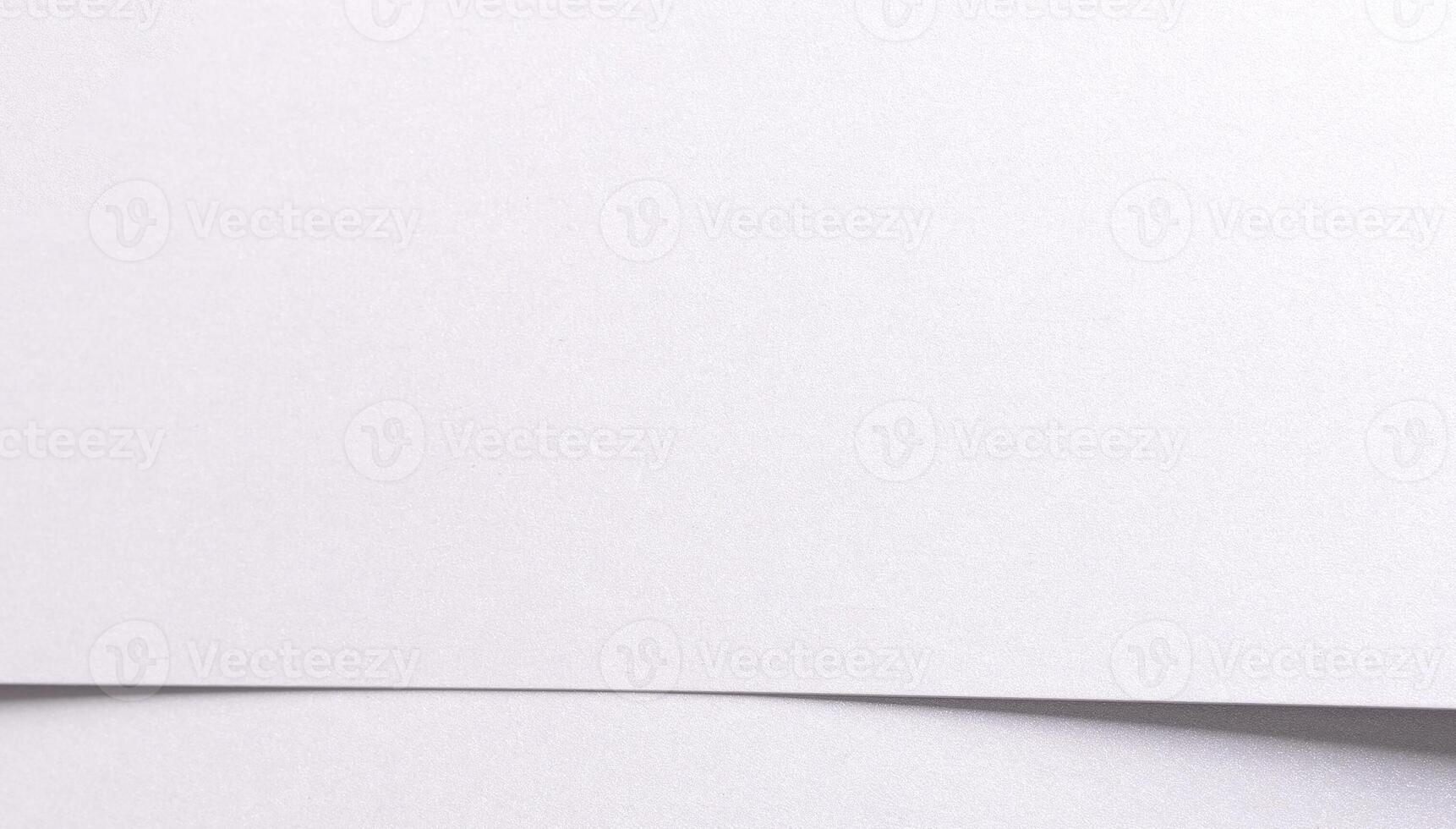 White matte paper background with a fine grainy texture and clean horizontal layout. Featuring photo