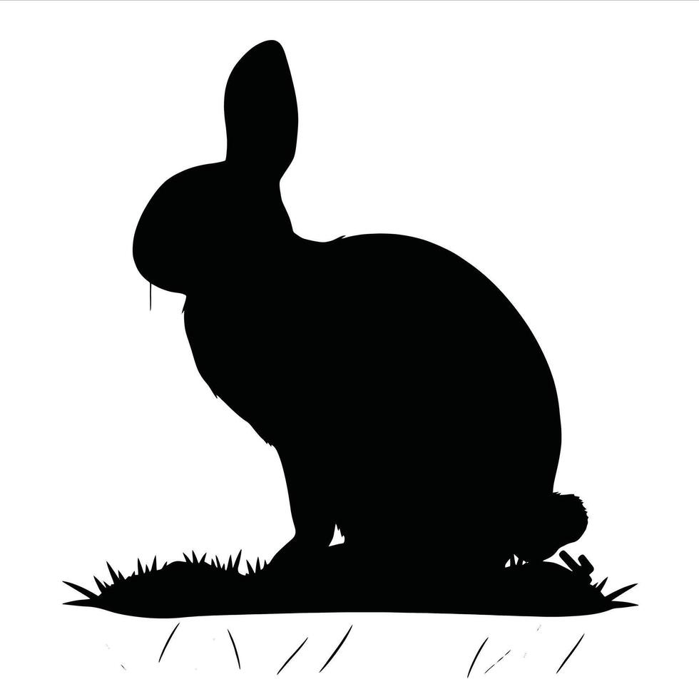 A black and white silhouette of a rabbit sitting on grass vector