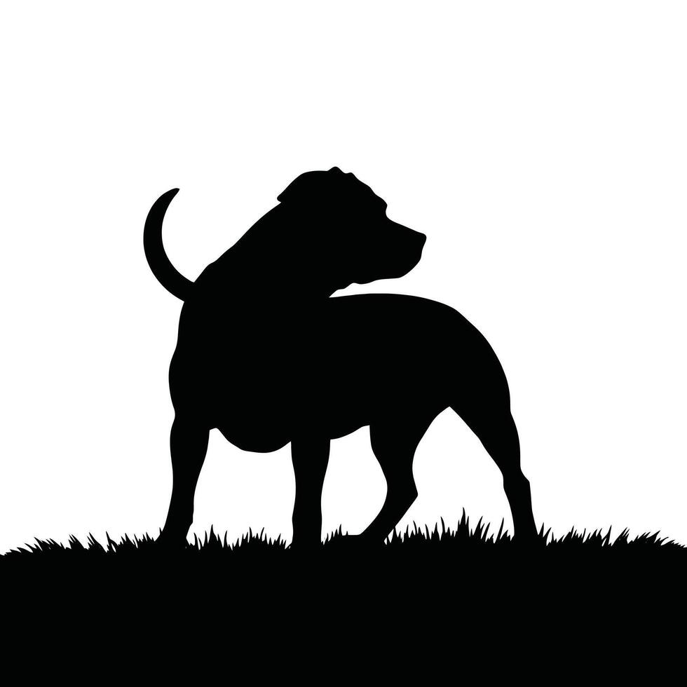 A silhouette of a dog standing on grass vector
