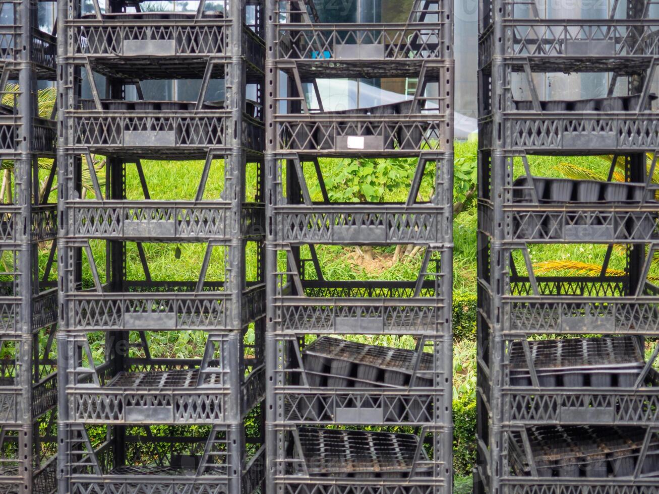 Stacked boxes on top of each other. Seedling boxes. Empty containers on the street photo
