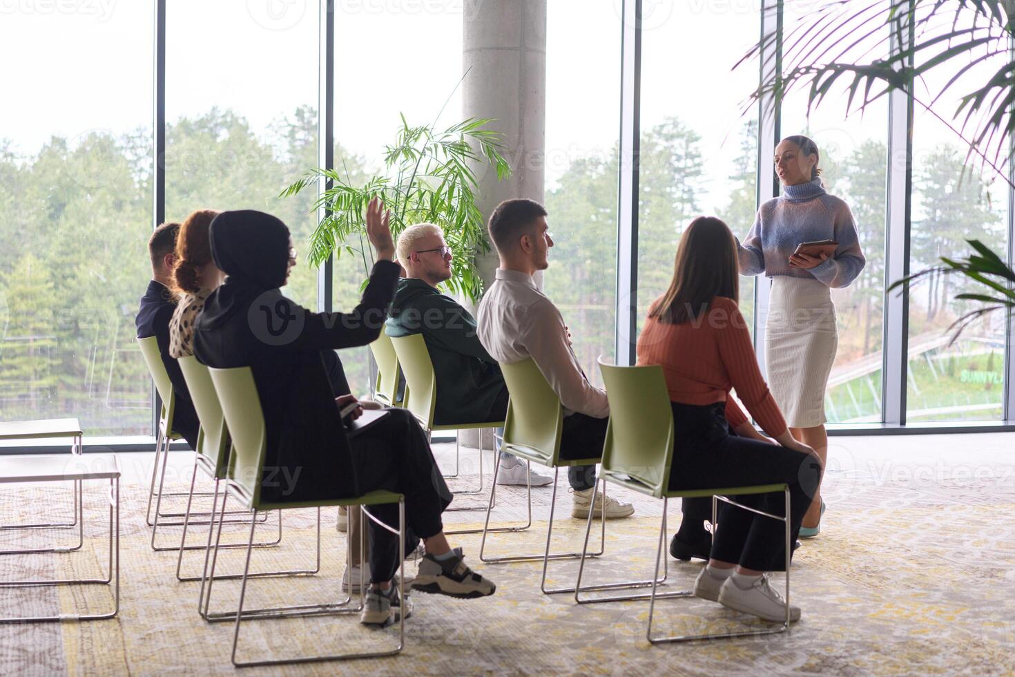 A businesswoman leader guiding a meeting with her colleagues, discussing business challenges, marketing strategies, and new plans for growth and success photo