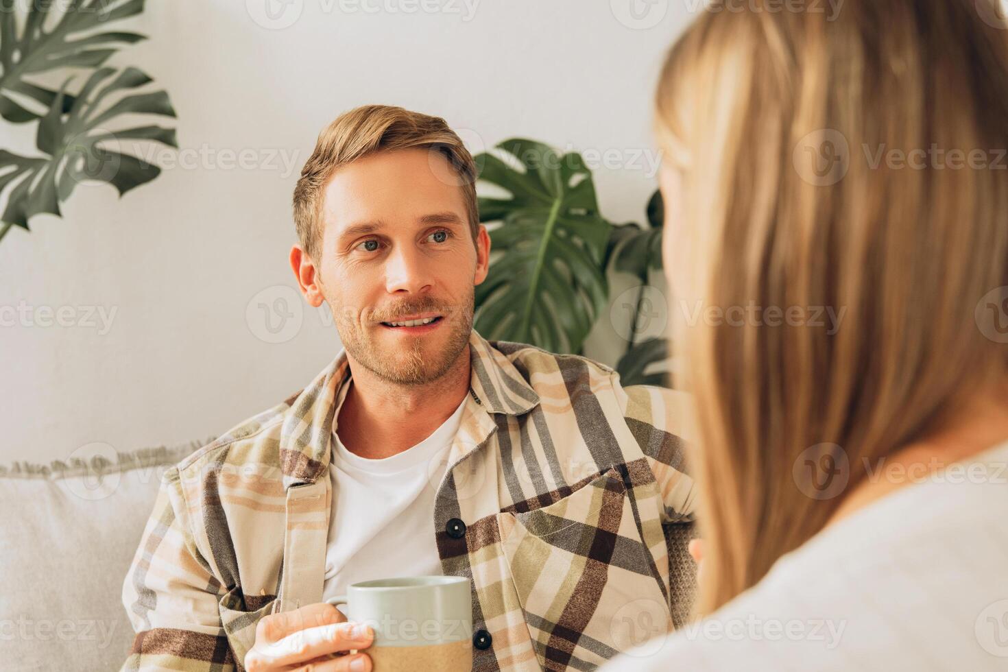 Portrait of handsome man and woman, attractive couple in love talking each other photo