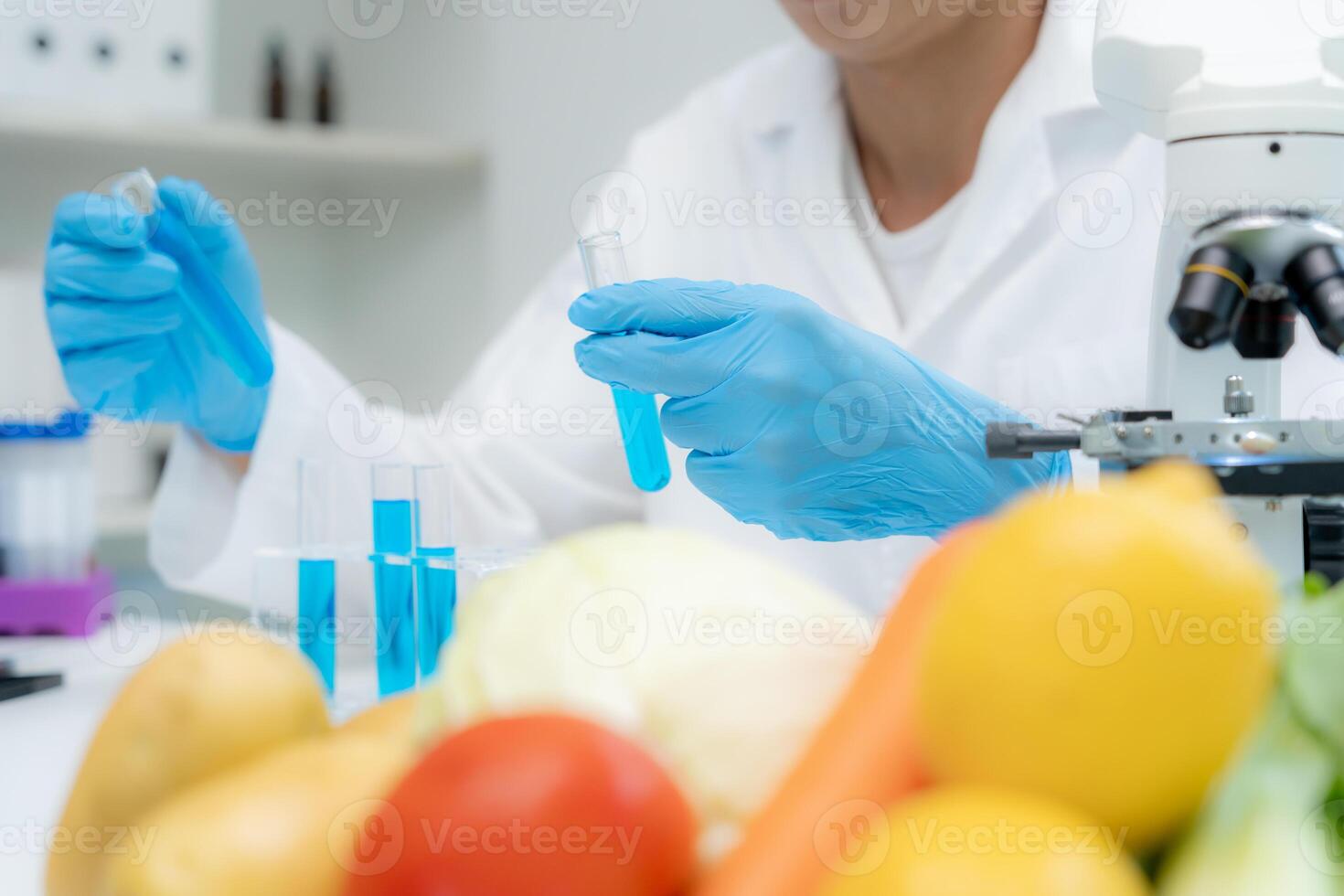 Scientist check chemical food residues in laboratory. Control experts inspect quality of fruits, vegetables. lab, hazards, ROHs, find prohibited substances, contaminate, Microscope, Microbiologist photo